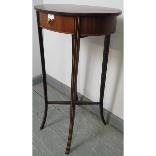 789 - An Edwardian mahogany oval side table, with single drawer, on outswept supports inlaid with satinwoo... 