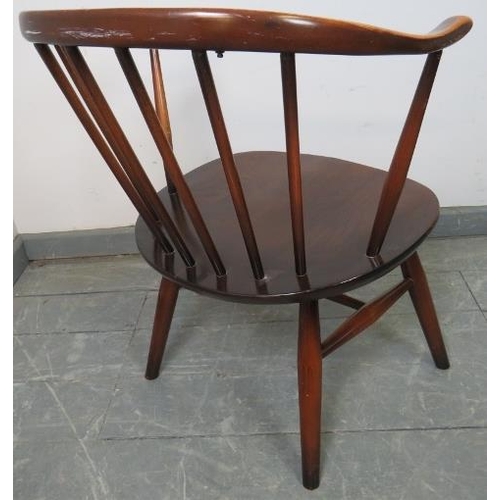 792 - A mid-century elm ‘cowhorn’ tub chair by Ercol (model 333a) on canted supports with an ‘H’ stretcher... 