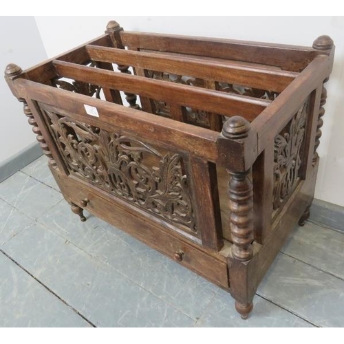 797 - A turn of the century Anglo-Indian hardwood Canterbury, with foliate carved and pierced sides, ball ... 