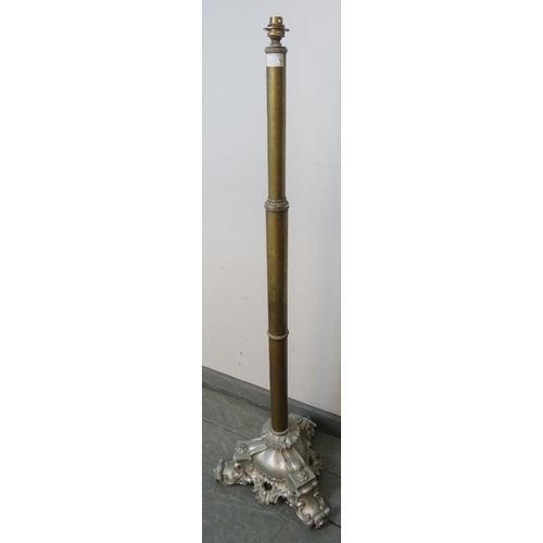 801 - A 19th century telescopic brass standard lamp, on a very ornate cast metal tripod base with scrolled... 