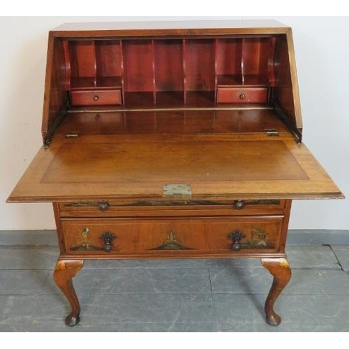 802 - A vintage walnut chinoiserie bureau, hand-painted and relief carved with oriental scenes, the fall-f... 