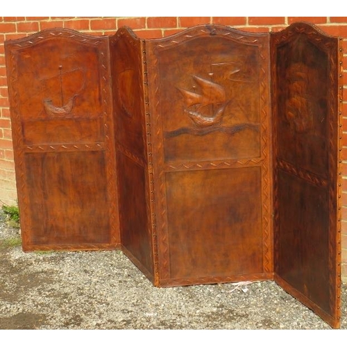 805 - A vintage four section folding screen, covered with patinated brown leather featuring embossed depic... 