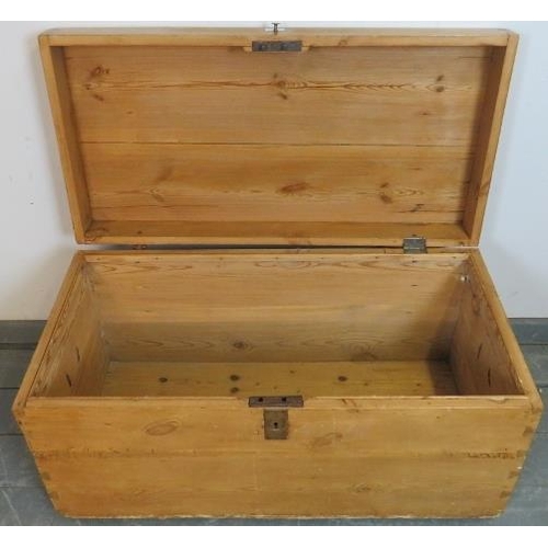 809 - An antique stripped pine flat top trunk/blanket box with cast iron strapwork hinges and handles to e... 