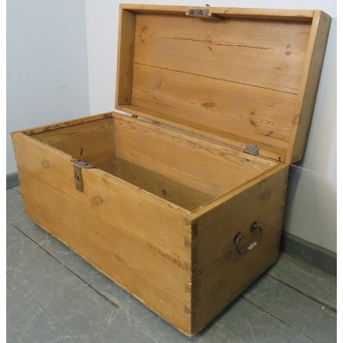 809 - An antique stripped pine flat top trunk/blanket box with cast iron strapwork hinges and handles to e... 