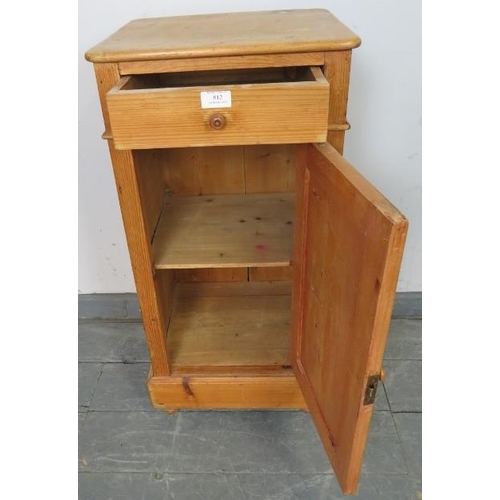 812 - An antique stripped pine bedside cabinet with single drawer and cupboard under with loose shelf, on ... 