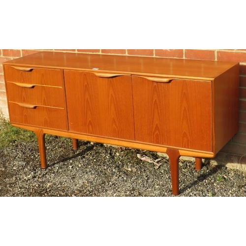 816 - A mid-century teak sideboard by McIntosh, housing three short drawers with scalloped handles and cup... 