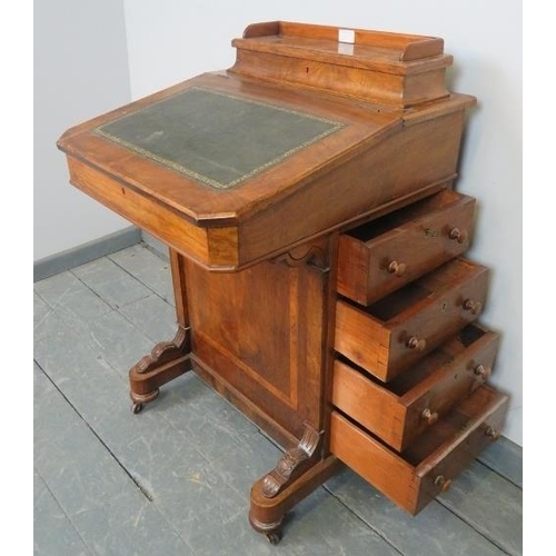 829 - A Victorian walnut Davenport with upper gallery and inset green leather writing surface, the lid ope... 