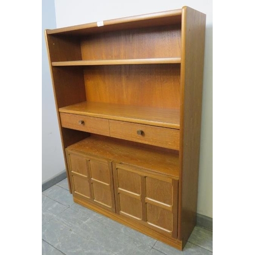 846 - A mid-century teak tall bookcase by Parker Knoll, with one long drawer and cupboard under, on a plin... 