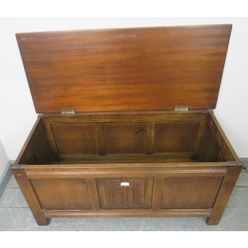 848 - A vintage oak panelled coffer in the 18th century taste, featuring linenfold centre detail, on stile... 