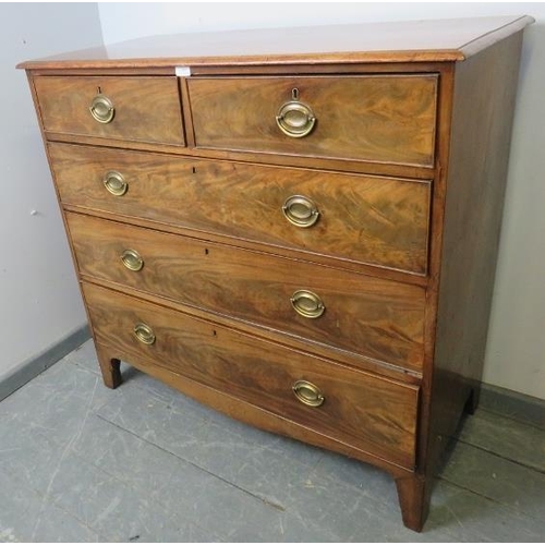 850 - A Georgian walnut chest of two short over three long graduated cock-beaded drawers with pressed bras... 