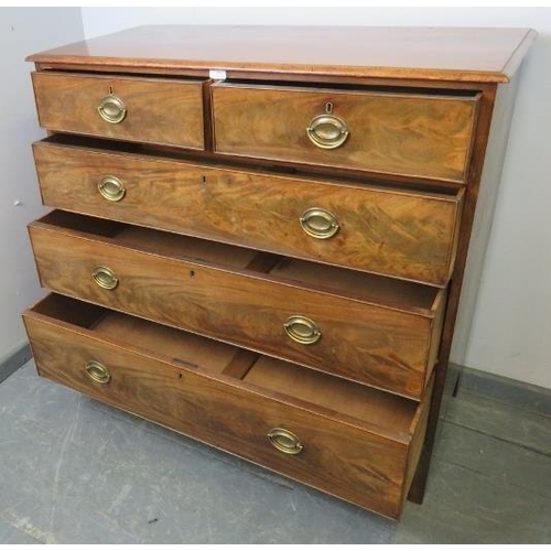 850 - A Georgian walnut chest of two short over three long graduated cock-beaded drawers with pressed bras... 