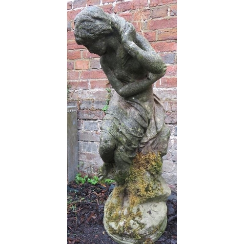 878 - A nicely weathered reconstituted stone garden statue in the form of a classical maiden. 
Condition r... 