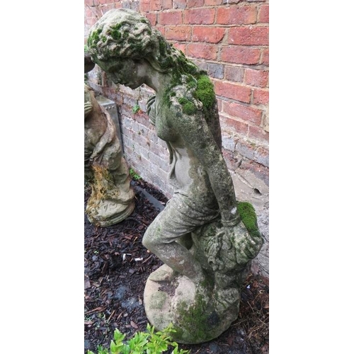 879 - A nicely weathered reconstituted stone garden statue in the form of a classical maiden. 
Condition r... 