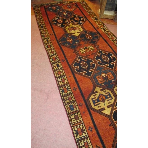 901 - A fine South West Persian Qashqai runner, central pattern on a burnt amber field and in very good co... 