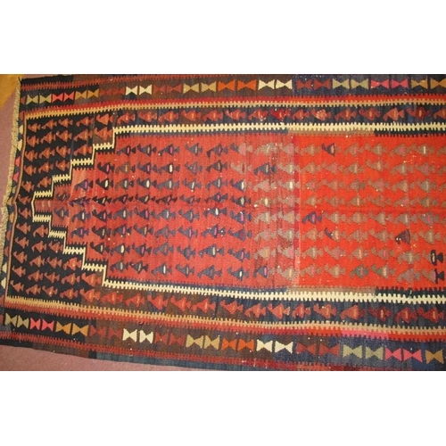 905 - A North West Persian Senneh Kilim rug, strong colours and in good condition. 2.18 x .90 metres.