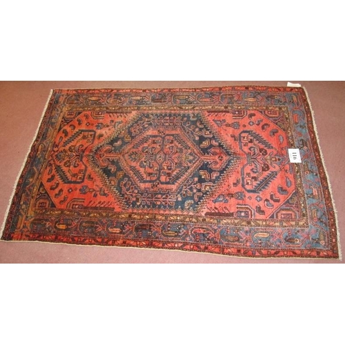 911 - A North West Persian Malayer rug, central blue motif on claret ground, with stylised birds. In good ... 