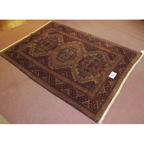 912 - A Turkish Kazak rug, a repeat tri pattern on soft muted ground, clean rug in condition 189 x 127cm.