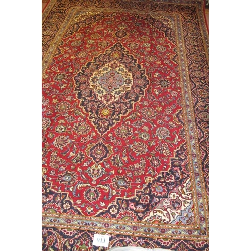 913 - An excellent central Persian Kashan carpet, central pattern rising from cream to blue to red. In ver... 