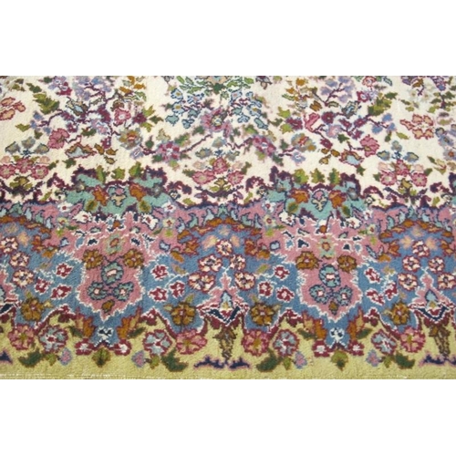 914 - A central Persian Kerman rug, very soft pastel colours, floral pattern and in good condition 184 x 1... 