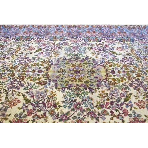 914 - A central Persian Kerman rug, very soft pastel colours, floral pattern and in good condition 184 x 1... 