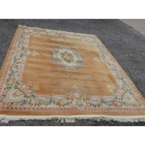 916 - A very large good quality thick pile Chinese carpet on beige ground. 480 x 360cm (approx 16'x12').
C... 