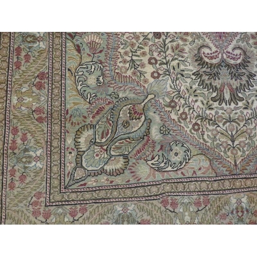 919 - A fine Persian carpet, central floral pattern on minted field, 76