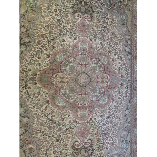 919 - A fine Persian carpet, central floral pattern on minted field, 76