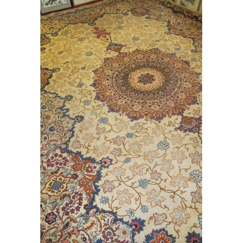 928 - An excellent Persian Meshed carpet, large central motif, set on cream ground 393cm x 272cm. Very goo... 