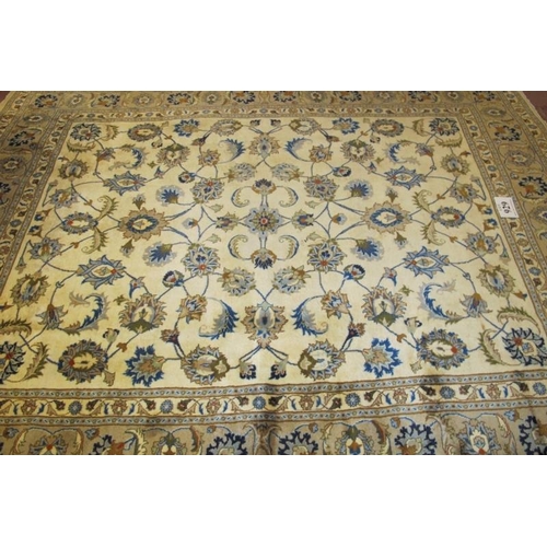 929 - A good Kashan carpet, a central foliage panel on cream ground, flanked by wide borders in fawn. Good... 