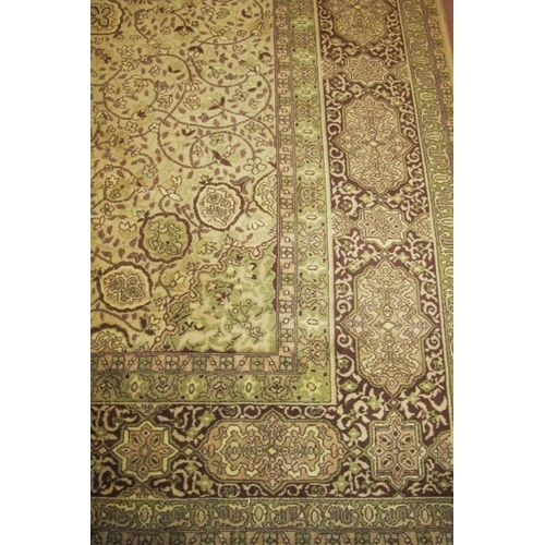 930 - A 20th century part wool carpet, green fawn and brown floral pattern. 276 x 360cm.