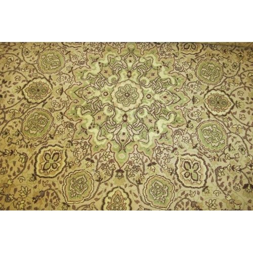 930 - A 20th century part wool carpet, green fawn and brown floral pattern. 276 x 360cm.