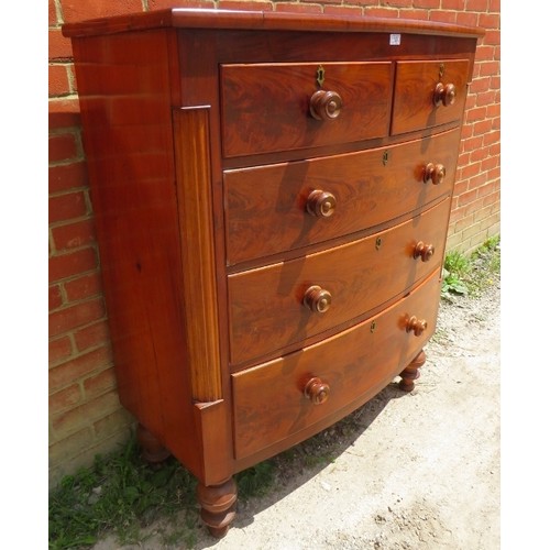 861 - An early Victorian mahogany chest of two short over three long graduated drawers with original turne... 