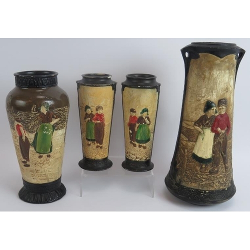 103 - Four Bretby pottery vases each hand decorated over relief traditional Dutch scenes. Tallest 32.5cm. ... 