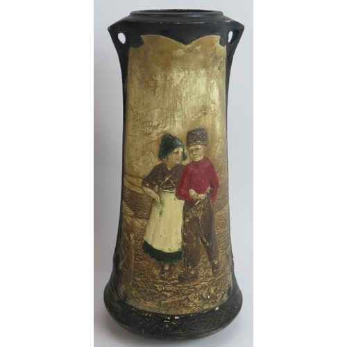 103 - Four Bretby pottery vases each hand decorated over relief traditional Dutch scenes. Tallest 32.5cm. ... 