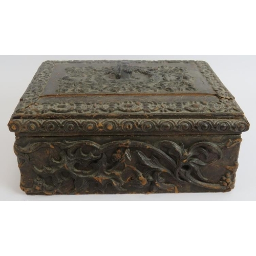 104 - A heavily embossed leather antique workbox with contents including pin cushions, scent bottle, greet... 