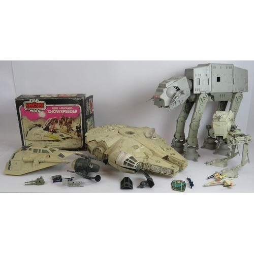 105 - A collection of vintage Star Wars toys including a boxed Palitoy Snow Speeder, a Kenner Products 197... 