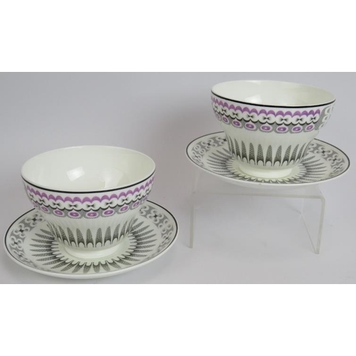 111 - Two Edward Bawden for Wedgwood Orient Line cups and saucers, black and purple decoration. Saucer 14.... 