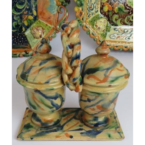 121 - Two highly decorative continental Majolica platters, a two jar serving cruet and three hand decorate... 