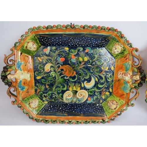 121 - Two highly decorative continental Majolica platters, a two jar serving cruet and three hand decorate... 