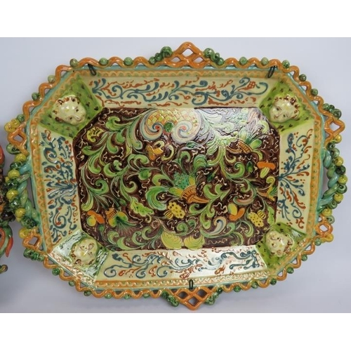 121 - Two highly decorative continental Majolica platters, a two jar serving cruet and three hand decorate... 