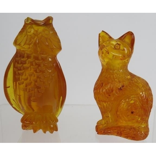 124 - A carved Baltic Amber figure of a cat and a similar figure of an owl. Tallest 7cm. (2).
Condition re... 