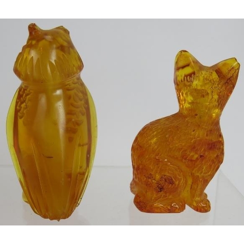 124 - A carved Baltic Amber figure of a cat and a similar figure of an owl. Tallest 7cm. (2).
Condition re... 