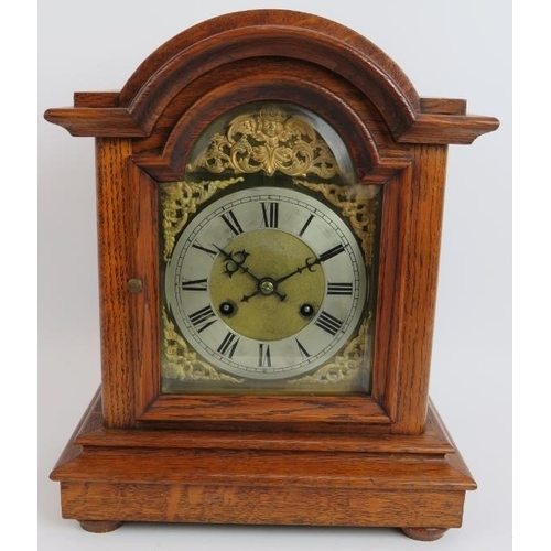 126 - An oak cased mantel clock with striking and chiming German movement marked CB (Badische-Uhrenfabrik)... 