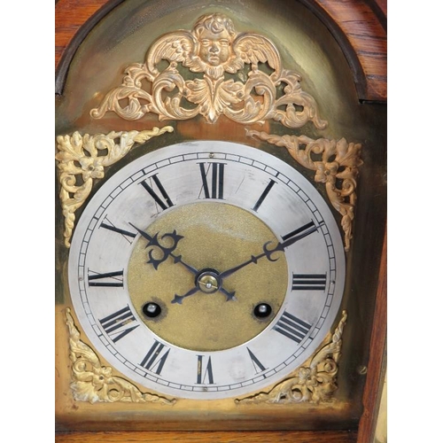 126 - An oak cased mantel clock with striking and chiming German movement marked CB (Badische-Uhrenfabrik)... 