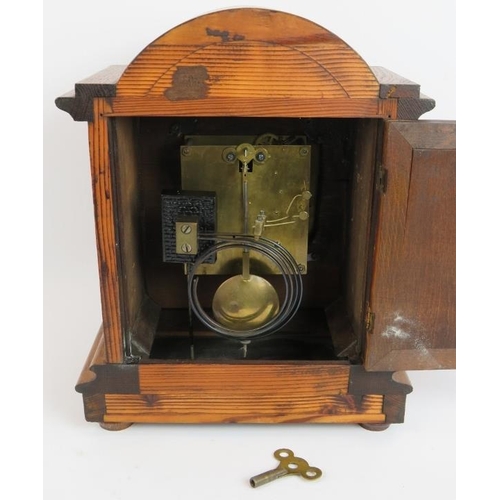 126 - An oak cased mantel clock with striking and chiming German movement marked CB (Badische-Uhrenfabrik)... 