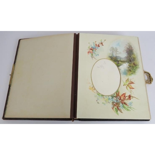 130 - A leather bound Victorian photo album with Art Nouveau decorated binding, gilt edges pages and gilt ... 