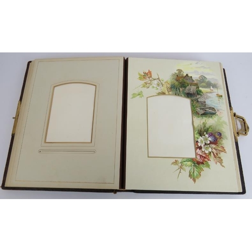 130 - A leather bound Victorian photo album with Art Nouveau decorated binding, gilt edges pages and gilt ... 