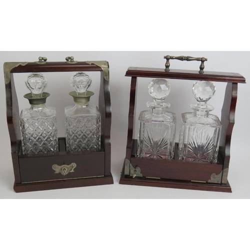 135 - An Edinburgh crystal two decanter mahogany tantalus and a similar two decanter tantalus, both with k... 