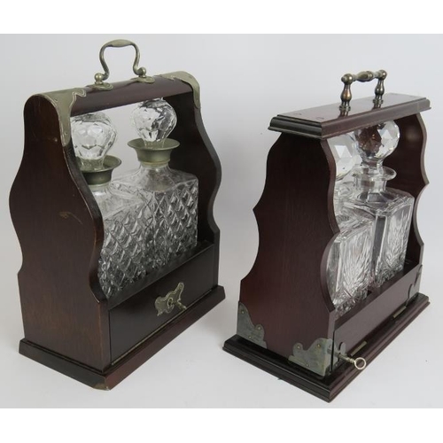 135 - An Edinburgh crystal two decanter mahogany tantalus and a similar two decanter tantalus, both with k... 