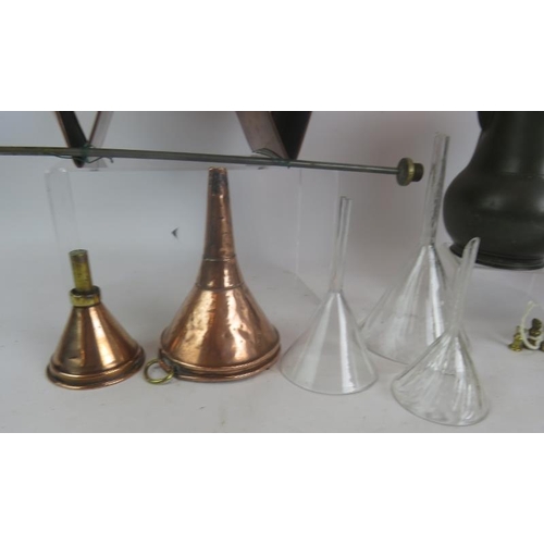 140 - An antique copper brewery barrel funnel, 2 copper and 3 glass funnels, set of 7 brass bell weights, ... 